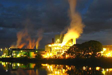 A photograph of a sugar mill, Murwillumbah NSW. To get the shot at night Michael set up a tripod at the end of the old bridge crossing.